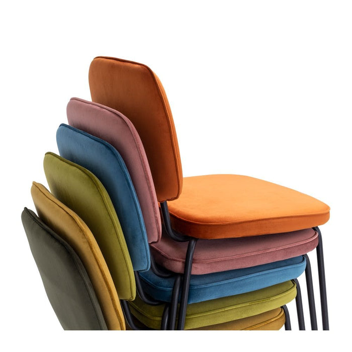 Clyde Meadow Green Velvet Dining Chair will add a pop of colour to any dining room—they’re available in eight different upholstery colours including everything from burnt orange, meadow green, olive, ocean blue.
